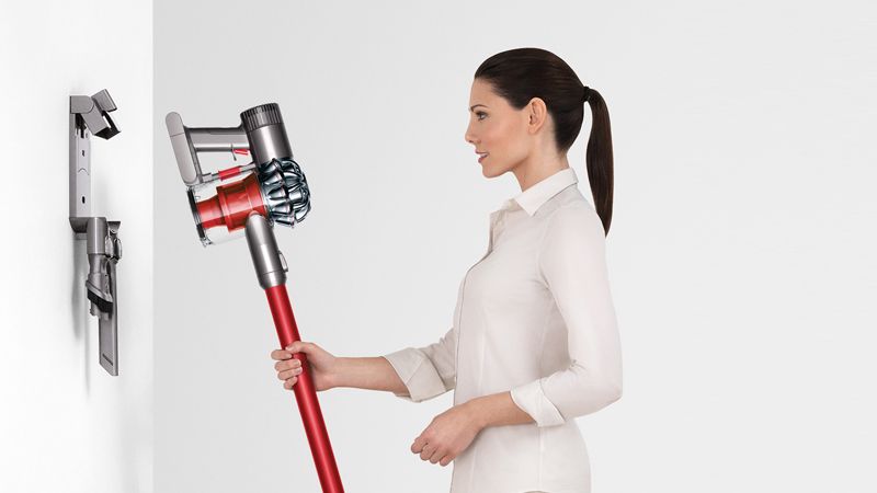 Model with Dyson wall-mounted dock